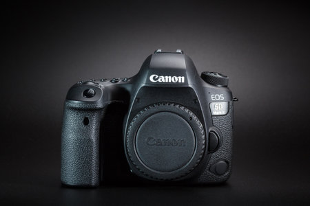 Kamyanets-Podilskyi, Ukraine - May 22, 2020: Canon EOS 6D Mark II Body on black background. Front view.のeditorial素材
