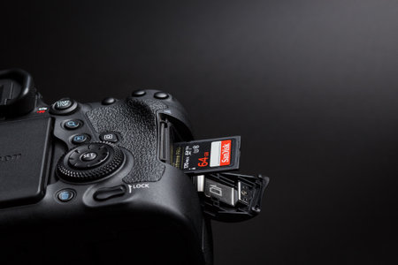 Kamyanets-Podilskyi, Ukraine - May 22, 2020: Canon EOS 6D Mark II Body and Sandisk memory card in slot on black backgroundのeditorial素材