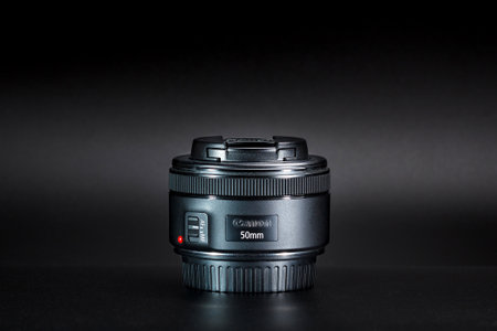 Kamyanets-Podilskyi, Ukraine - May 22, 2020: Canon EF-50 mm F / 1.8 STM Lens on black background.のeditorial素材