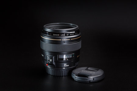 Kamyanets-Podilskyi, Ukraine - May 22, 2020: Canon EF-85mm F / 1.8 USM Lens on black blackground.のeditorial素材