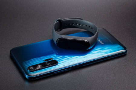 Kamyanets-Podilskyi, Ukraine - May 22, 2020: Honor 20 Pro 8 / 256GB Phantom Blue mobile phone and...