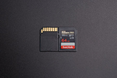 Kamyanets-Podilskyi, Ukraine - May 22, 2020: SanDisk SDXC Extreme Pro V30 64GB C10 UHS-I U3 on black background.のeditorial素材
