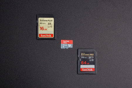 Kamyanets-Podilskyi, Ukraine - May 22, 2020: SanDisk SDXC Extreme Pro V30 64GB C10 UHS-I U3, SanDisk Ultra microSDXC UHS-I 64GB, SanDisk SDHC 16Gb eXtreme Plus UHS-I on black background.のeditorial素材