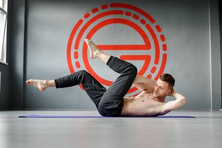 Young athletic man is doing exerciseの写真素材