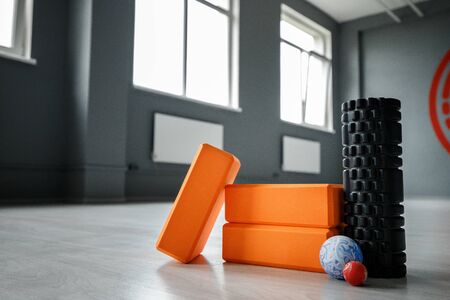 Yoga roller, yoga bricks, and small fitness balls. Yoga and fitness equipment.の写真素材