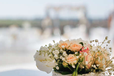 Beautiful wedding flowers in a basket with blurred backgroundの写真素材