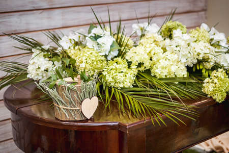 Wooden box for wedding rings on the tableの写真素材