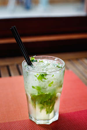 Fresh mojito cocktail on the table in the bar. Cool tropical cocktail.の写真素材