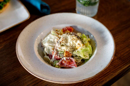 Fresh Caesar salad on a plateの写真素材