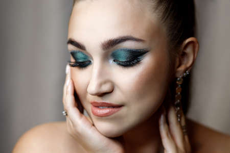 Portrait of a beautiful young girl with makeupの写真素材