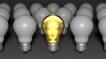 One golden light bulb among many white light bulbs  One golden idea among many not interesting ideasの写真素材