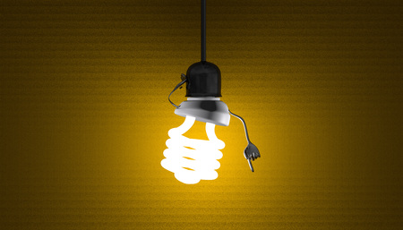 Glowing fluorescent light bulb character in lamp socket on wire in moment of insight on yellow textured backgroundの写真素材