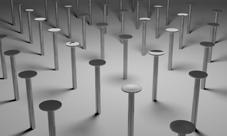 Some new glossy steel nails on gray backgroundの写真素材