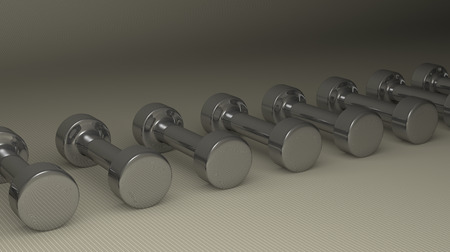 Row of fixed-weight metallic glossy cylindrical dumbbells lying on gray checkered background, perspective viewの写真素材