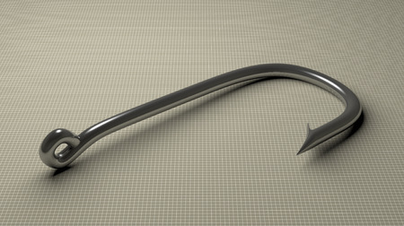Steel glossy fish hook lying on gray checkered backgroundの写真素材