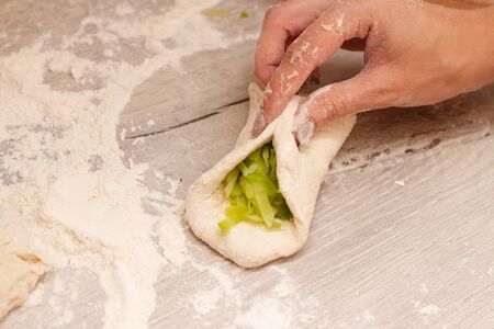 filling for a pies on a baking sheet with flour