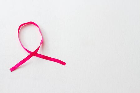 Pink ribbon breast cancer on white background.の写真素材