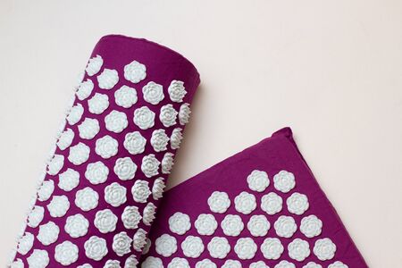 Acupressure mat and pillow on white backgroundの写真素材