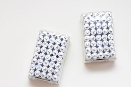 packaging of new alkaline AAA batteries on white backgroundの写真素材