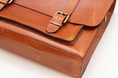 brown leather briefcase corner closure closeup