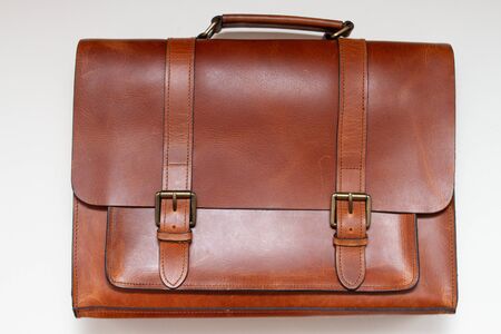 a brown classic briefcase made of genuine leather on a white backgroundの写真素材