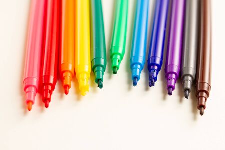 opened Multi-colored Markers on white backgroundの写真素材
