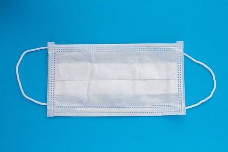 medical mask on a blue backgroundの写真素材