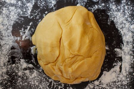 dough for pastry on baking sheet with flour.の写真素材
