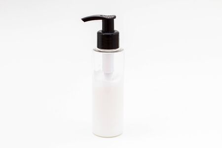 clear transparent plastic bottle with body cream lotion on white background.の写真素材