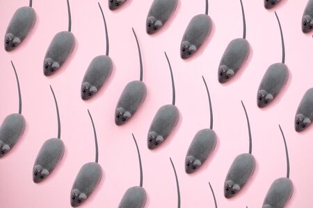 Gray Toys mouse pattern on pink background.の写真素材