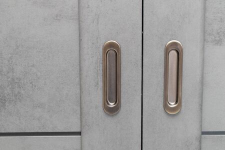 Gray modern Entrance door Exterior. Closed sliding Door with metal handlesの写真素材