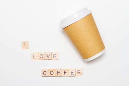 Inscription I love coffee made of wooden blocks with paper coffee cup. Top view.の写真素材