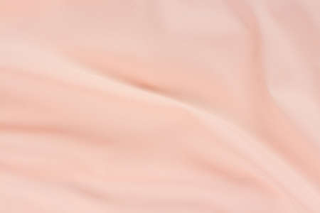 Silk pink fabric waves background full frame textureの写真素材