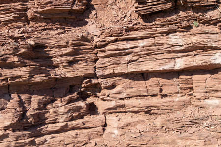 Orange texture rock of rock stone. Stone wall undergroundの写真素材