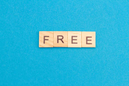 FREE word from wooden blocks on a blue background.の写真素材