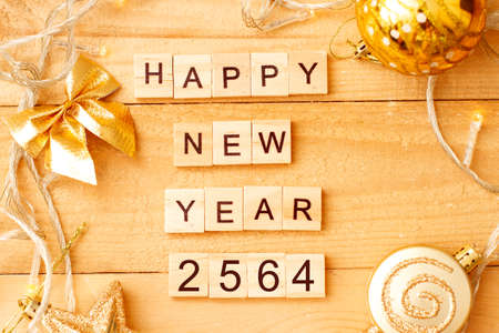Word HAPPY NEW YEAR 2564 made from wooden cubes with decoration for Chistmas. Banner, backdrop. Thai new year.の写真素材