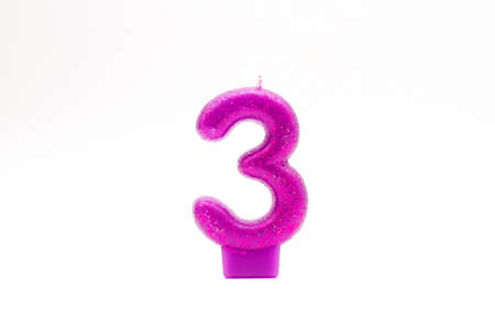 Number three candle. Purple Glitter 3 Birthday Candleの写真素材