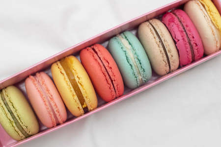 Multicolored macaroon in a cardboard gift box.の写真素材