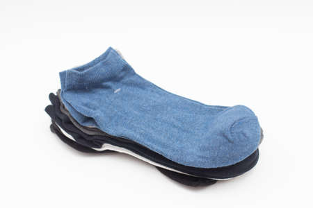 Pack of a classic sock in different colors on a white background.の写真素材