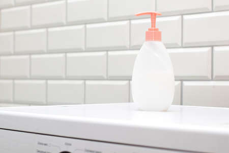 Blank bottles with liquid soap dispenser in bathroomの写真素材