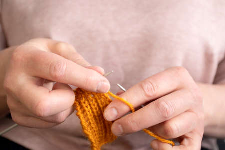 Womens hands knit. Handmade creative working concept