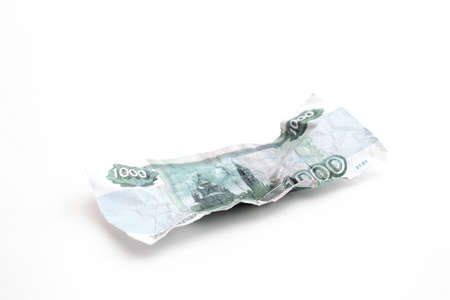 Crumpled one thousand ruble bill on a white background