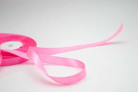 Pink ribbon scroll on white background. Breast Cancer Awareness Conceptの写真素材