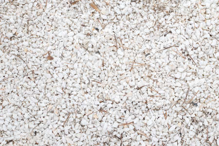 Background of white marble chips. Crushed marble stone. Natural surface pattern sandstone.