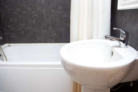 Bathroom sink and faucet in modern bathroom interior. Washbasin and bath.
