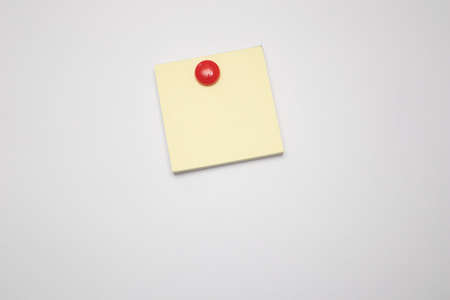 Empty paper sheet on white fridge doorの写真素材