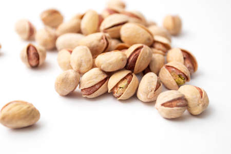 Pile of pistachios on a white background. Set of Pistachio nuts.の写真素材