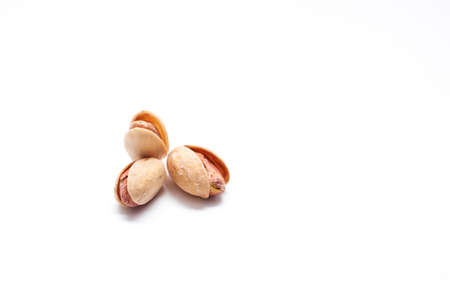 Pistachios isolated on a white background. Salted Pistachio nutsの写真素材