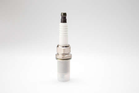 A new spark plugs on white background.
