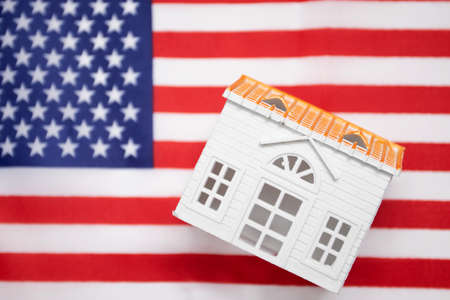 US Embassy. A toy house on the US flag.の写真素材